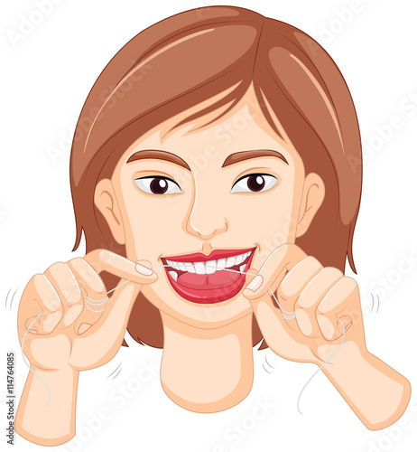 Woman flossing the teeth