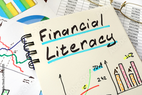 Photos Financial Literacy written on a notepad sheet.