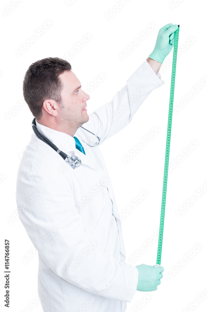 Male doctor or nutritionist measuring with body ruler Male doctor or nutritionist measuring with body ruler