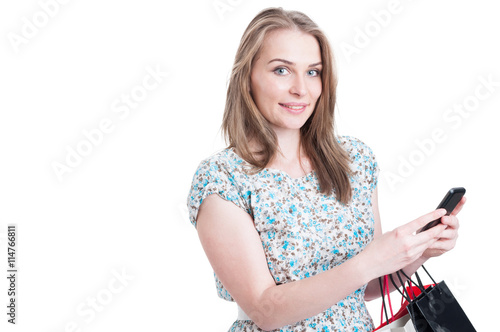Portrait of attractive woman sending messages on cellphone