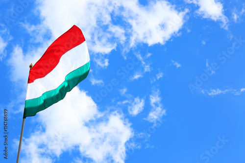 Hungary flag on sky background