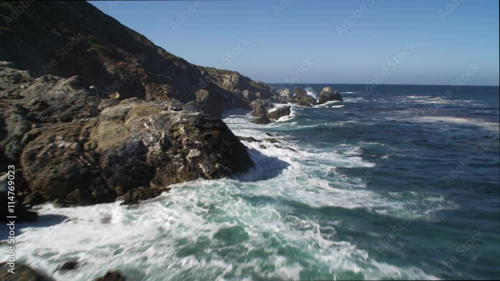 Over foamy surf along rocky Catalina coast. Shot in 2010. Over foamy surf along rocky Catalina coast. Shot in 2010.