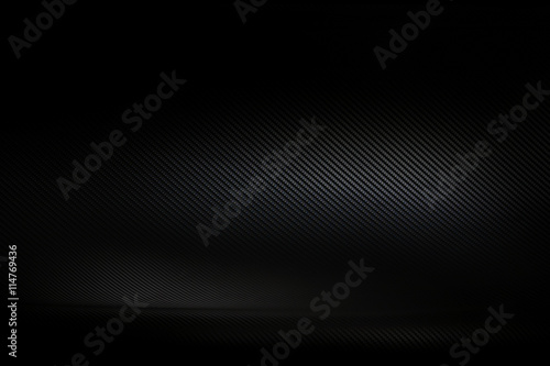 Dark and black carbon fiber background texture photo