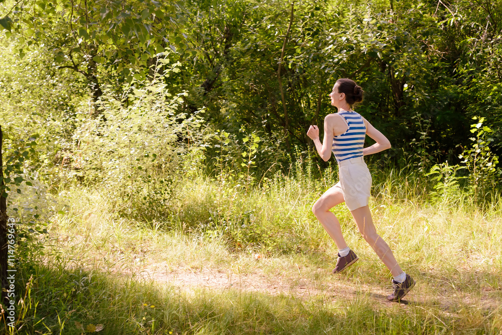 Senior Woman Running in the Forest