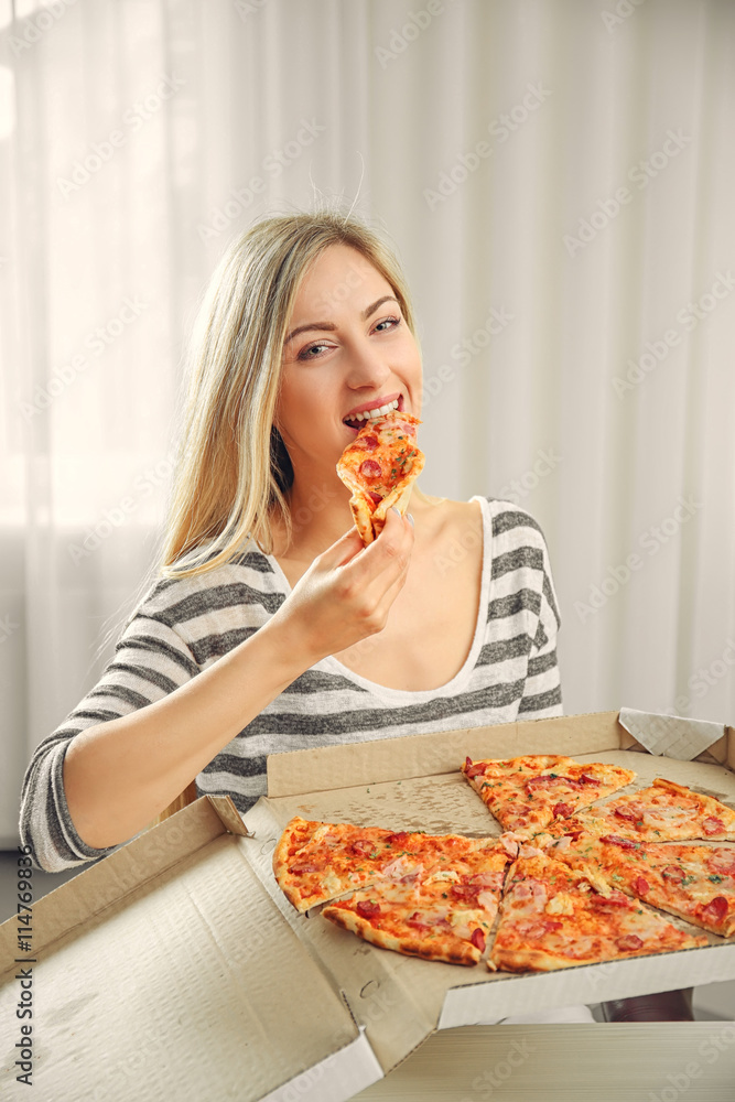 Beautiful woman eating pizza Beautiful woman eating pizza