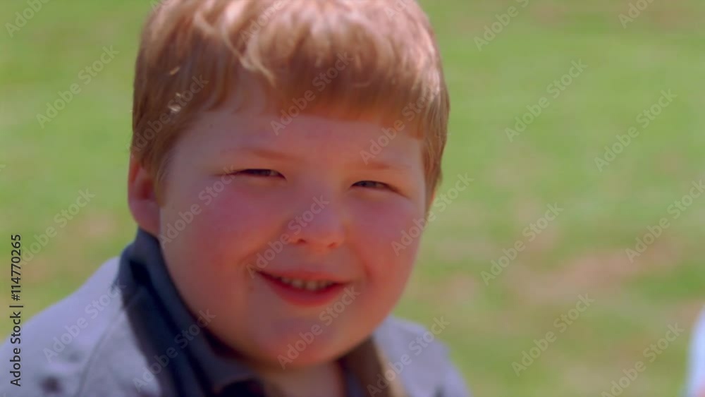 Close-up round face of a smiling chubby little boy Close-up round face of a smiling chubby little boy