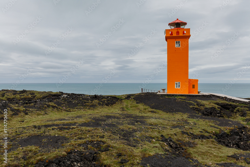 Orange lighthouse at the coast of Iceland. Skalasnagi lighthouse in Snaefellsnes Peninsula, west Iceland