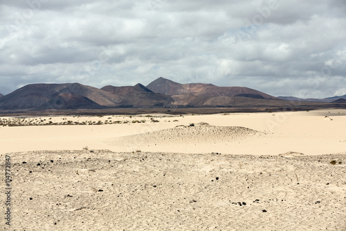 Corralejo sand dunes and extinct volcanoes including montana Roja in the background. Fuerteventura, Canary Islands, Spain