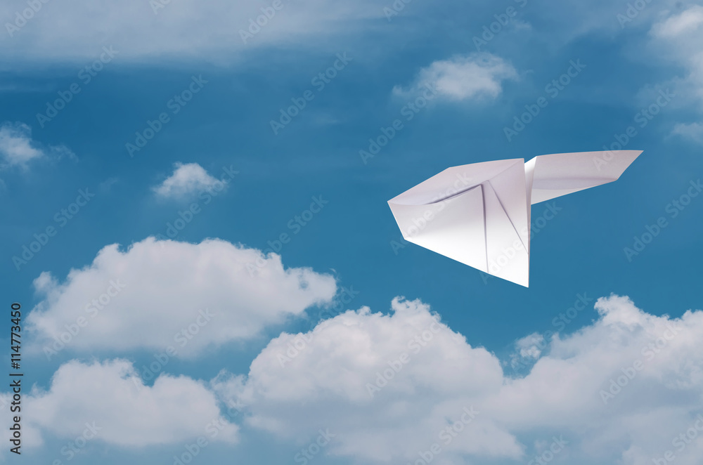 Paper plane flying over clouds with blue sky. Paper plane flying over clouds with blue sky.