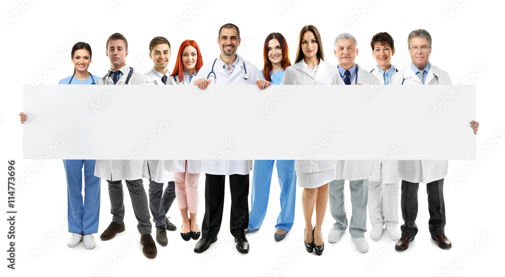 Obraz premium Smiling doctors with white banner, isolated on white