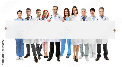 Smiling doctors with white ...