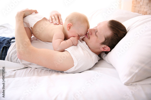 Young father having fun wit...