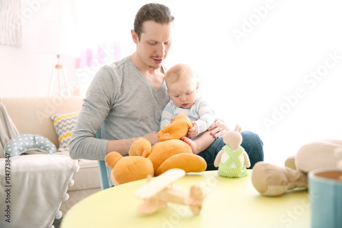 Young father having fun wit...