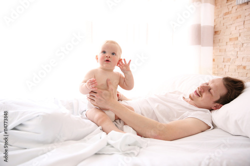 Young father having fun wit...