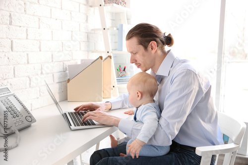 Young father with his littl...