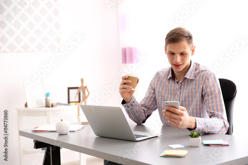 Man working at computer at ...