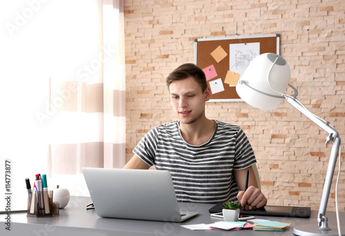 Man working at computer at ...