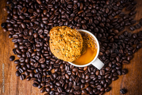 Cup of coffee with whole grains cookies