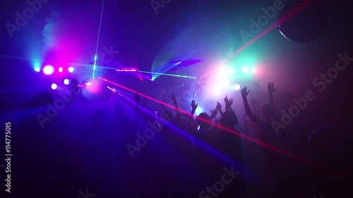 Young people dancing in night club