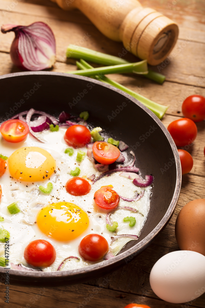 Fried eggs with vegetables. Healthy breakfast Fried eggs with vegetables. Healthy breakfast