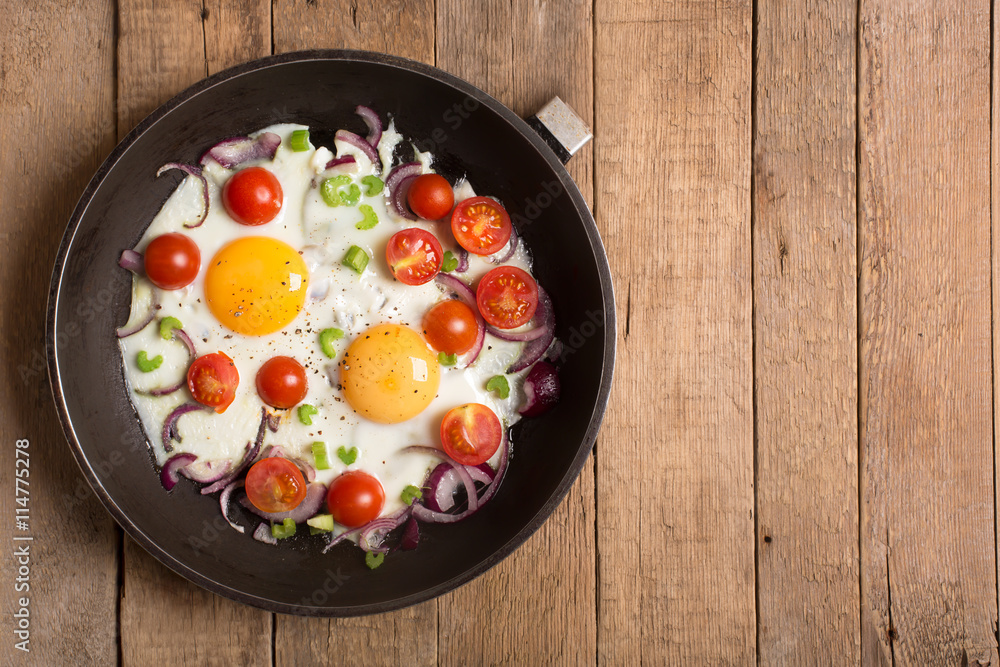 Fried eggs with onion and other vegetables Fried eggs with onion and other vegetables