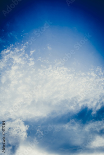 Abstract of gorgeous sky with fluffy clouds in blue tone background © fangphotolia