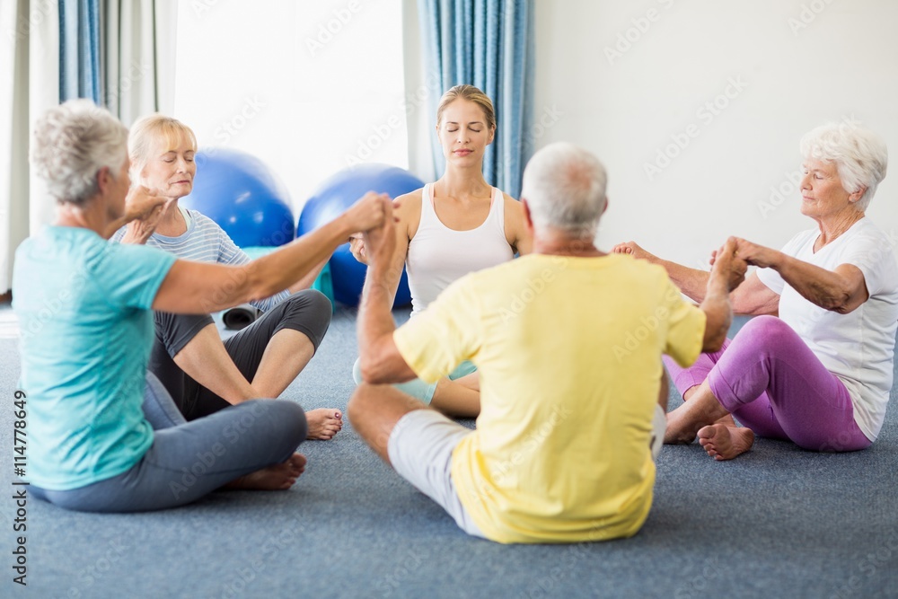 Seniors performing yoga