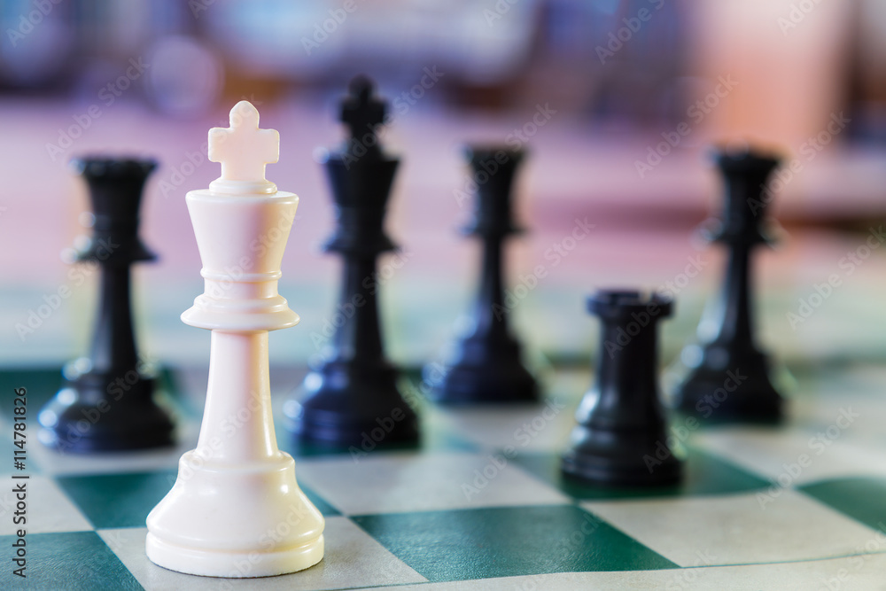 White chess king surrounded White chess king surrounded