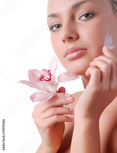 face of woman and orchid