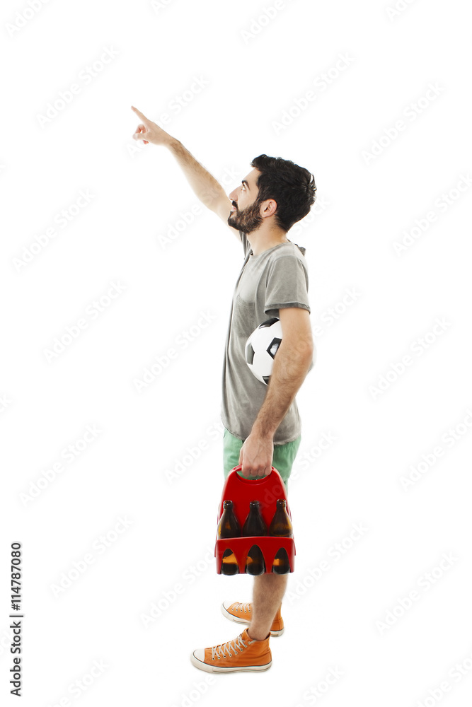 Young man holding ball and pack of beer, pointing. Isolated on white background
Young man holding ball and pack of beer, pointing. Isolated on white background