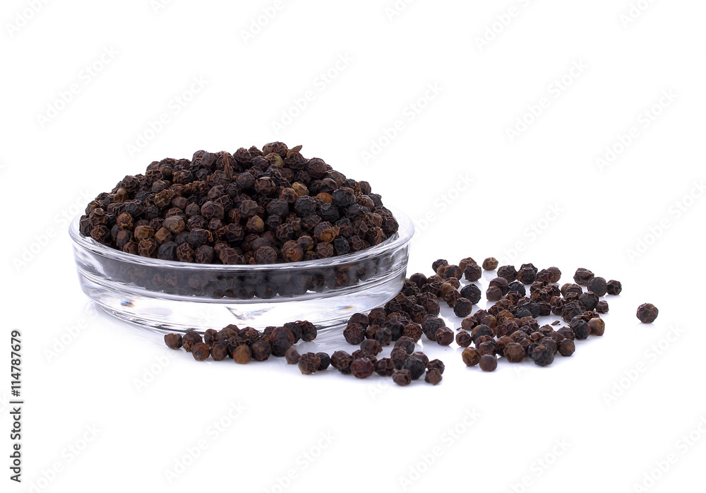 Black pepper seeds pile on white background Black pepper seeds pile on white background