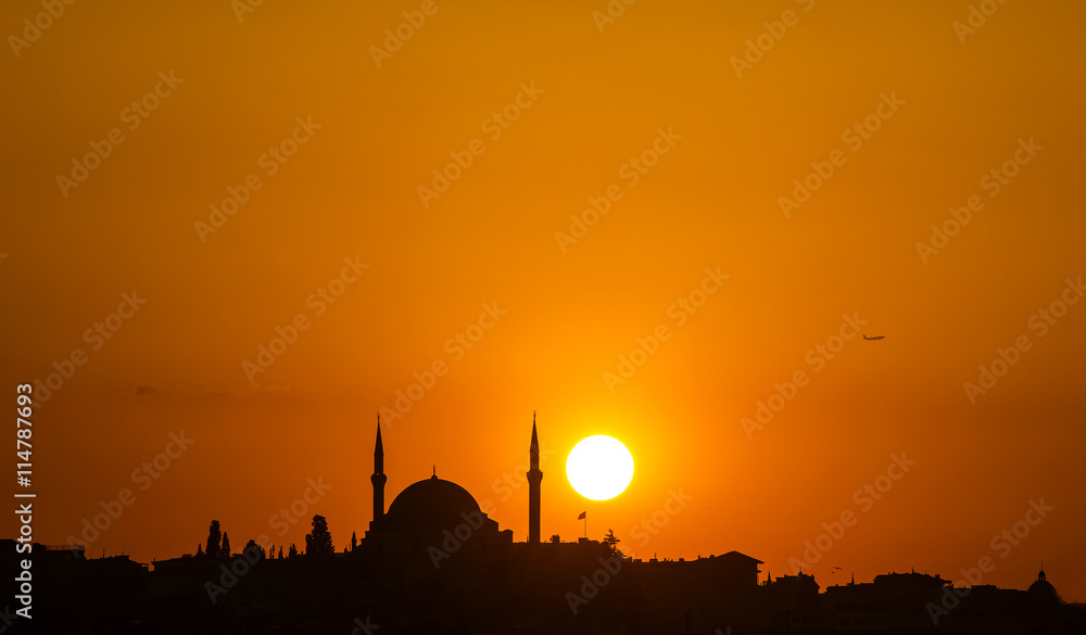 The old mosque and minaret at sunset in Istanbul