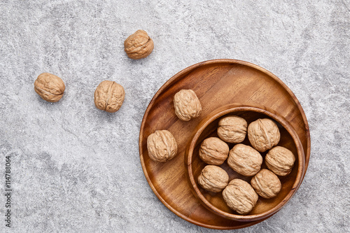 walnuts on rustic background. Walnuts kernels and nutcracker. fr