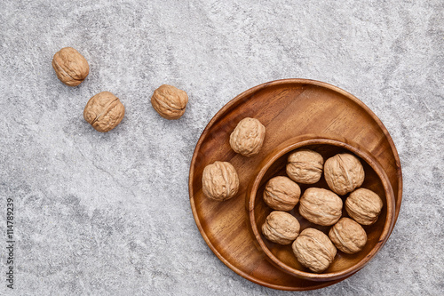 walnuts on rustic background. Walnuts kernels and nutcracker. fr