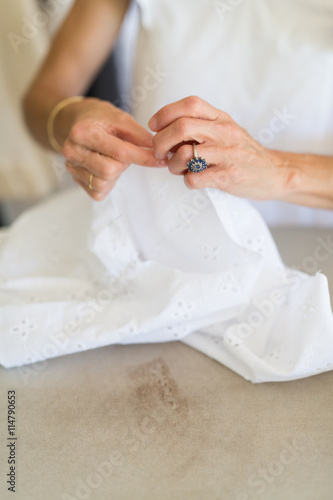 seamstress making white top