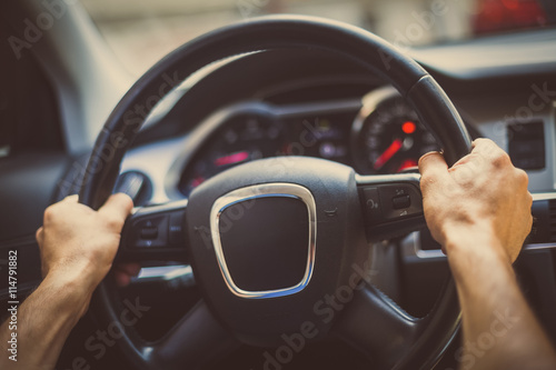 Fototapet Hands on steering wheel