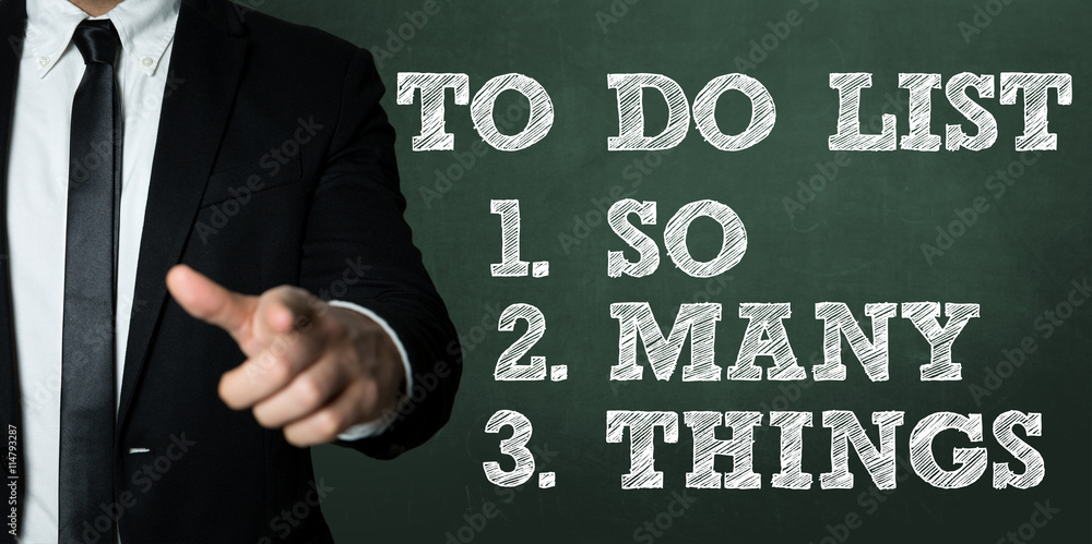 Business man pointing with the text: To Do List - So Many Things Business man pointing with the text: To Do List - So Many Things