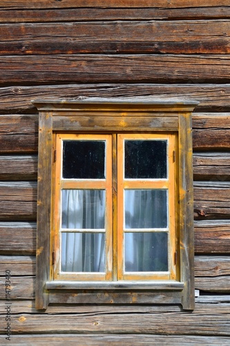 Window on log house
