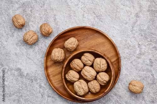 walnuts on rustic background. Walnuts kernels and nutcracker. fr