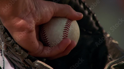 Close-up of ball in glove of left-handed pitcher