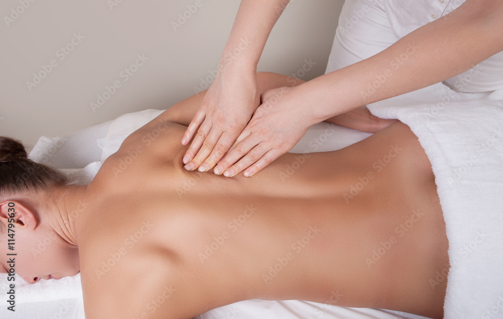 Connective tissue massage on a muscle group of a woman's back Connective tissue massage on a muscle group of a woman's back