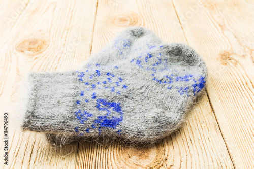 Wool socks on old wooden background