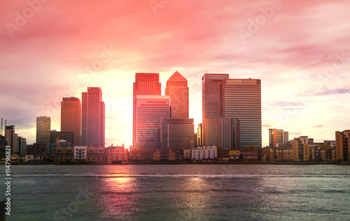 London, Canary Wharf office buildings at sunse