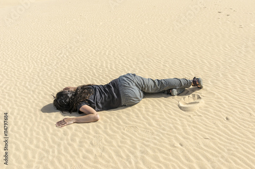 Woman fainted in desert sand