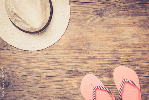 Summer accessories on an old wooden background