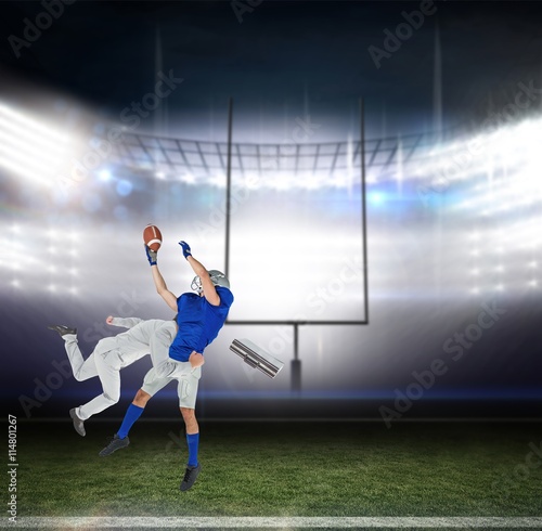 Composite image of businessman tackling a football player © vectorfusionart