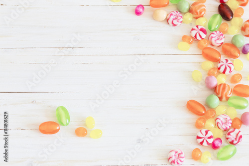variety of candies on a wooden background