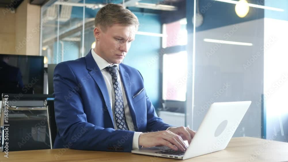 Businessman working on laptop Businessman working on laptop