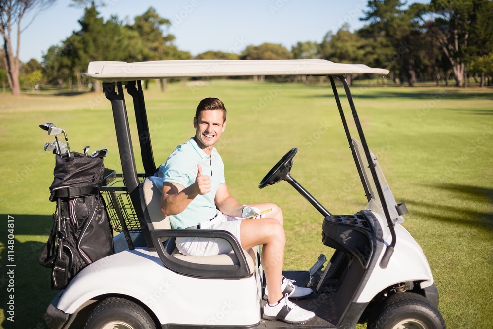Portrait of golfer man showing thumbs up 
