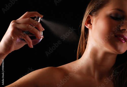 womanand bottle of perfume photo